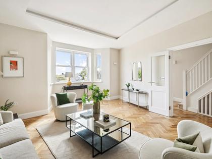 Freshly decorated living room with herringbone oak floor